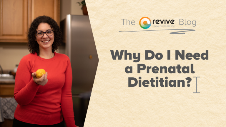 A smiling woman with curly hair, wearing glasses and a red sweater, holds a lemon in a kitchen setting. Beside her, a graphic with a beige background features the logo of 'The Revive Blog' by Revive Wellness Inc. and a large text question 'Why Do I Need a Prenatal Dietitian?' in bold, dark font.